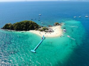 Koh Phi Phi to Phuket
Idyllic aerial view of Koh Khai Nai Island's turquoise waters and sandy beaches in Phuket, Thailand.